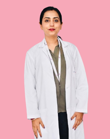 Dr. Neha Kumari smiling in her clinic environment holding a clipboard